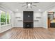 Living room with hardwood floors, fireplace, and access to kitchen at 2357 Rover Ct, Atlanta, GA 30317