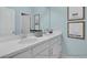 Shared bathroom with double sinks and white cabinetry at 525 Nolden Trl, Dacula, GA 30019
