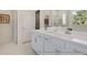 Elegant bathroom with double vanity and quartz countertops at 525 Nolden Trl, Dacula, GA 30019