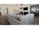 Living room featuring a cozy fireplace and large sectional sofa at 525 Nolden Trl, Dacula, GA 30019