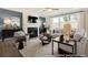 Living room with fireplace, large windows, and comfortable seating at 525 Nolden Trl, Dacula, GA 30019