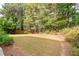 Spacious backyard with a large grassy area at 6467 Century Park Se Pl, Mableton, GA 30126