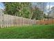 Large backyard with wooden fence and grassy area at 1052 Brookhaven Ne Walk, Brookhaven, GA 30319