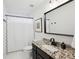 Clean bathroom with granite countertop and black fixtures at 1052 Brookhaven Ne Walk, Brookhaven, GA 30319