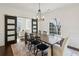 Formal dining room with a large arched window and barn doors at 1052 Brookhaven Ne Walk, Brookhaven, GA 30319