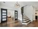 Open entryway showcasing a modern staircase and barn doors at 1052 Brookhaven Ne Walk, Brookhaven, GA 30319