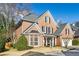 Two-story brick home with a gray roof and landscaped front yard at 1052 Brookhaven Ne Walk, Brookhaven, GA 30319