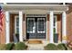 Elegant double front doors with black frames and sidelights at 1052 Brookhaven Ne Walk, Brookhaven, GA 30319