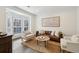 Cozy living room with a neutral color palette and ample natural light at 1052 Brookhaven Ne Walk, Brookhaven, GA 30319