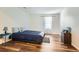 Well-lit bedroom featuring a double bed and wood-look flooring at 1945 Brian Way, Decatur, GA 30033