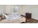 Bright bedroom with hardwood floors, full bed, and sliding glass doors at 1945 Brian Way, Decatur, GA 30033