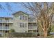 Two-story building with light green siding, balconies, and landscaping at 1945 Brian Way, Decatur, GA 30033