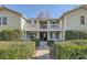 Inviting exterior of a two-story condo building with well-manicured landscaping at 1945 Brian Way, Decatur, GA 30033