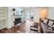 Living room with fireplace, hardwood floors, and built in shelving at 1945 Brian Way, Decatur, GA 30033