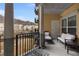 Outdoor balcony with seating and views of trees and buildings at 200 River Vista Dr # 427, Atlanta, GA 30339