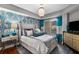 Main bedroom with teal accents and hardwood floors at 200 River Vista Dr # 427, Atlanta, GA 30339