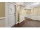 Building hallway with wood floors and neutral walls at 200 River Vista Dr # 427, Atlanta, GA 30339