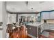 Open concept kitchen with island and hardwood floors at 200 River Vista Dr # 427, Atlanta, GA 30339