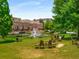 Community pond with fountain and seating area at 200 River Vista Dr # 427, Atlanta, GA 30339