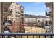 Community view from balcony with green space and buildings at 200 River Vista Dr # 427, Atlanta, GA 30339