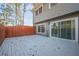 A view of the back deck showing its connection to the house through sliding glass doors at 2698 Farmstead Se Rd, Smyrna, GA 30080