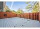 A view of the back deck showing the fence and the exterior trees at 2698 Farmstead Se Rd, Smyrna, GA 30080