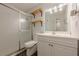 Renovated bathroom featuring a shower with glass doors, and a modern vanity with a mirror at 2698 Farmstead Se Rd, Smyrna, GA 30080