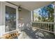 Front porch with white railing and door leading into the house at 2698 Farmstead Se Rd, Smyrna, GA 30080