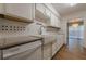 View of kitchen with granite countertops and modern appliances at 2698 Farmstead Se Rd, Smyrna, GA 30080