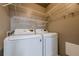 Convenient laundry room featuring full size washer and dryer at 2698 Farmstead Se Rd, Smyrna, GA 30080