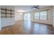 Bright and airy living room with sleek hardwood flooring, sliding glass doors, and open shelving for modern decor at 2698 Farmstead Se Rd, Smyrna, GA 30080