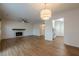 Bright living room with hardwood floors, fireplace, and access to kitchen at 2698 Farmstead Se Rd, Smyrna, GA 30080