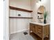 Bathroom with floating vanity, patterned tile floor, and floating shelves at 501 Dargan Sw Pl, Atlanta, GA 30310