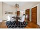 Bright dining room features hardwood floors, a decorative rug, and a charming wooden table at 501 Dargan Sw Pl, Atlanta, GA 30310