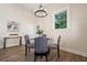 Bright dining room featuring a glass table and four gray chairs at 501 Dargan Sw Pl, Atlanta, GA 30310