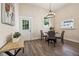 Casual dining area with glass table, chairs, and backyard access at 501 Dargan Sw Pl, Atlanta, GA 30310