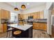 Modern kitchen with island, stainless steel appliances, and light wood cabinets at 501 Dargan Sw Pl, Atlanta, GA 30310