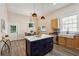 Updated kitchen with island, stainless steel appliances, and farmhouse sink at 501 Dargan Sw Pl, Atlanta, GA 30310