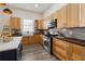 Modern kitchen with stainless steel appliances and light wood cabinets at 501 Dargan Sw Pl, Atlanta, GA 30310