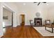 Living room with hardwood floors, fireplace, and access to hallway at 501 Dargan Sw Pl, Atlanta, GA 30310