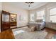 Main bedroom with ensuite bathroom access and hardwood floors at 501 Dargan Sw Pl, Atlanta, GA 30310