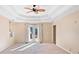 Main bedroom with french doors leading to the backyard and ceiling fan at 2620 Dr Bramblett Rd, Cumming, GA 30028