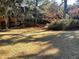 Landscaped backyard with mature trees at 28 Glenald Nw Way, Atlanta, GA 30327