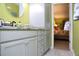 Modern bathroom with granite vanity and a large mirror at 28 Glenald Nw Way, Atlanta, GA 30327