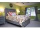 Bright bedroom with a floral bedspread and a window at 28 Glenald Nw Way, Atlanta, GA 30327