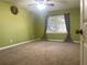 Spacious bedroom with neutral carpeting and ample closet space at 28 Glenald Nw Way, Atlanta, GA 30327