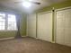 Bright bedroom featuring neutral walls, carpeting, and a window at 28 Glenald Nw Way, Atlanta, GA 30327