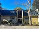 Attractive two-story condo building with dark roofing and landscaping at 28 Glenald Nw Way, Atlanta, GA 30327