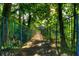 Wooden footbridge with metal railings, shaded by lush trees at 28 Glenald Nw Way, Atlanta, GA 30327