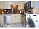 Updated kitchen with stainless steel appliances and tiled floor at 28 Glenald Nw Way, Atlanta, GA 30327